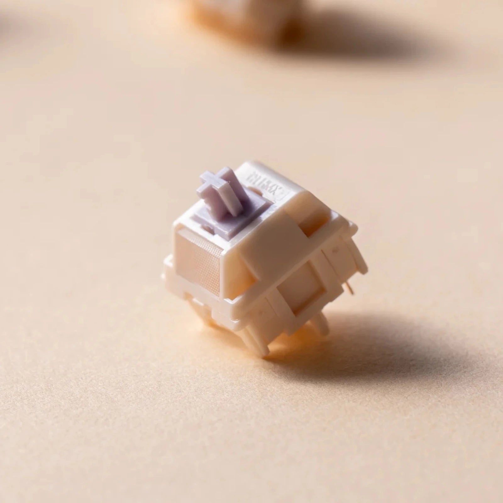 Keyboard switch on a beige surface